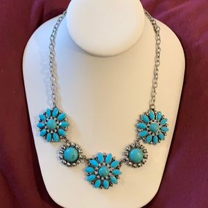 Silver tone turquoise look necklace.